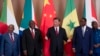 FILE - Chinese President Xi Jinping, center, and South African President Cyril Ramaphosa, second left, attend the China-Africa Leaders' Roundtable Dialogue in Johannesburg on Aug. 24, 2023. The IMF is warning African nations that China's slowing economy could hurt them.