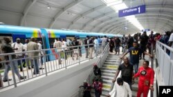 People exit from a new Lagos blue line train in Lagos, Nigeria on Monday, Sept. 4, 2023.