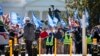 FILE - People protest for an extension and expansion of the Temporary Protected Status (TPS) program, Sept. 23, 2022, at Lafayette Park by the White House in Washington. 