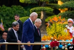 FILE - U.S. President Joe Biden participates in a welcome ceremony hosted by Vietnamese General Secretary Nguyen Phu Trong at the Presidential Palace in Hanoi on Sept. 10, 2023.
