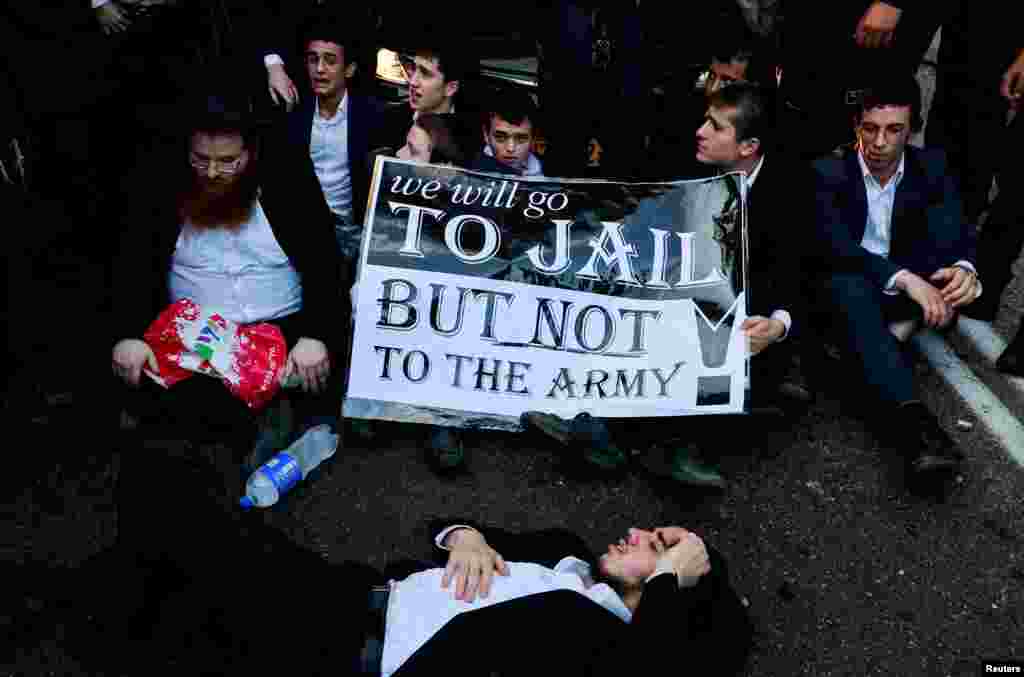 Ultra-Orthodox Jewish men protest after an Israeli Supreme Court ruling that requires the state to begin drafting ultra-Orthodox Jewish seminary students to the military, in Bnei Brak, Israel, July 16, 2024.