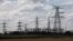 FILE - Electricity pylons are seen outside Keadby Power Station near Scunthorpe in northern England, Sept. 6, 2022.