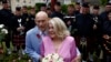 U.S. WWII veteran Harold Terens, 100, left, and Jeanne Swerlin, 96, arrive to celebrate their wedding at the town hall of Carentan-les-Marais in Normandy, France, June 8, 2024. 