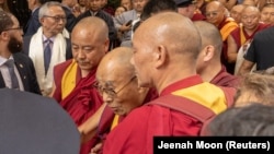 FILE - Tibetan spiritual leader, the Dalai Lama, arrives at his hotel in New York City, U.S., June 23, 2024.