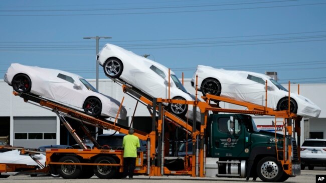 New Corvettes are delivered to a Chevrolet dealer in Wheeling, Ill., Tuesday, May 9, 2023.