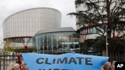 FILE —People demonstrate outside the European Court of Human Rights, Apr. 9, 2024 in Strasbourg, eastern France.