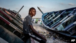 Salamba Ndiaye, a 28-year-old who tried to migrate to Europe twice, poses for a photo at the beach in Thiaroye-Sur-Mer, Senegal, Aug. 23, 2024. 