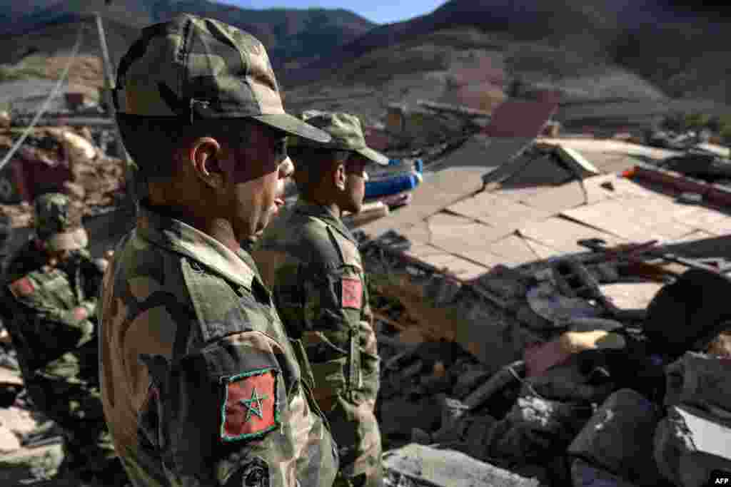 Moroccan Royal Armed Forces look at destroyed houses after an earthquake in the mountain village of Tafeghaghte, southwest of the city of Marrakesh, Morocco, on Sept. 9, 2023.