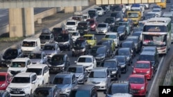 FILE - Vehicles are caught in congestion as the flow of traffic increases at toll road in Cikarang, West Java, Indonesia, Friday, April 29, 2022. Google says its AI-powered system helps improve traffic flow. (AP Photo/Achmad Ibrahim)