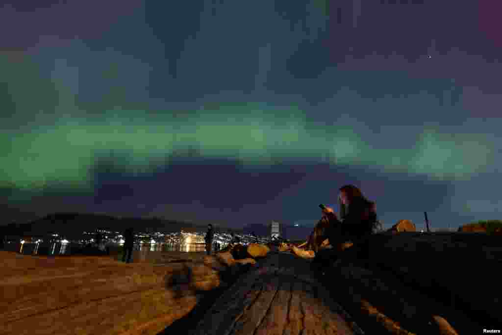 The aurora borealis illuminates the sky over Jericho Beach in Vancouver, British Columbia, Canada, May 10, 2024. 