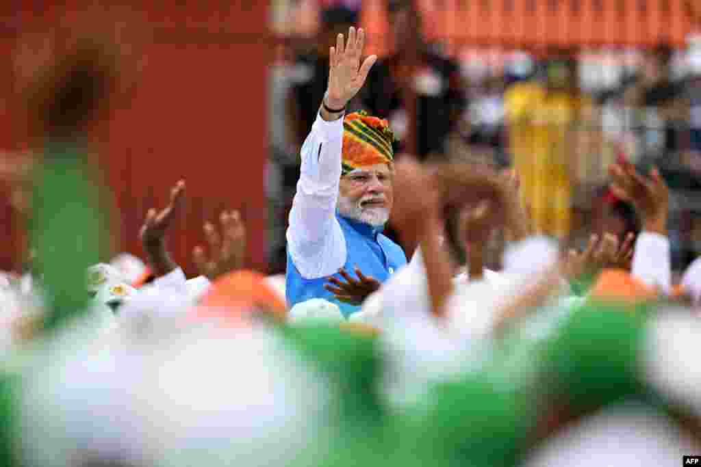 India's Prime Minister Narendra Modi meets school children, to mark the country's Independence Day, at the Red Fort in New Delhi.