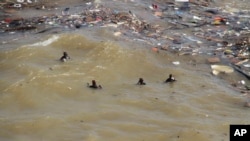 Divers look for flood victims in Derna, Libya, Sept. 18, 2023. 