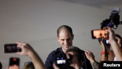 Evan Gershkovich, who was released from detention in Russia, reacts after disembarking from a plane at Joint Base Andrews in Maryland, U.S., August 1, 2024. REUTERS/Kevin Mohatt TPX IMAGES OF THE DAY 