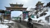 In this picture taken on April 5, 2023, motorbike riders cross into the snow laden Himalayan Sela pass in Tawang in northeast Indian state of Arunachal Pradesh.
