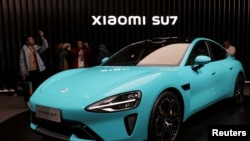 小米汽车在北京展示第一辆电动汽车SU7。（2023年12月28日）