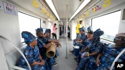 People ride on a new Lagos blue line train service in Lagos Nigeria on Monday, Sept. 4, 2023.