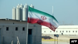 FILE - A Nov. 10, 2019, photo shows an Iranian flag at Iran's Bushehr nuclear power plant, during an official ceremony to kick-start works on a second reactor at the facility. 
