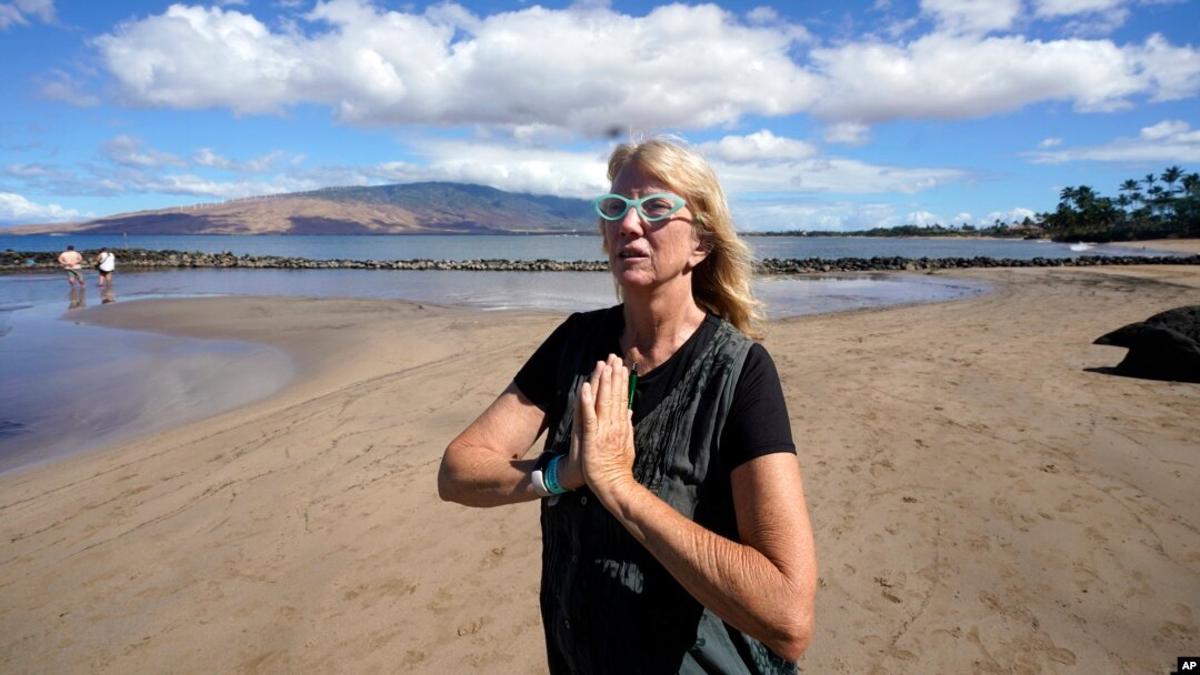 Anne Landon stands on a beach in Kihei, Hawaii, Aug. 15, 2023. The evacuation center at the South Maui Community Park Gymnasium is now her safe space, where she has a cot and access to food, water, showers, books and puzzles.