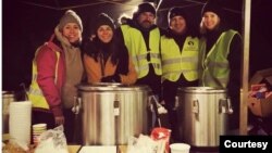 Natalia Kostykiewicz-Kolasinska and the mother of the Ukrainian refugee family volunteer at a soup kitchen at the the Polish-Ukrainian border. (Courtesy - Natalia Kostykiewicz-Kolasinska)