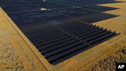 FILE - A solar farm is seen in Mona, Utah, Aug. 9, 2022.