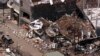 FILE - The wreckage of the Sari night club and surrounding buildings are seen in this aerial view Oct. 15, 2002, in Kuta, Bali.