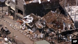 FILE - The wreckage of the Sari night club and surrounding buildings are seen in this aerial view Oct. 15, 2002, in Kuta, Bali.