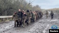 Ukrainian prisoners of war are seen during a swap, amid Russia's attack on Ukraine, at an unknown location, Ukraine, in this screengrab from a video released April 16, 2023. (Coordination Headquarters for the Treatment of Prisoners of War via Reuters) 