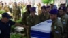 Soldiers carry a coffin of hostage Kiril Brodski, Israeli soldier who was killed during the October 7 attack by Palestinian Islamist group Hamas and held in Gaza until his body was recovered by Israeli forces, at his funeral in Tel Aviv, Israel, July 25, 2024. 