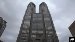 FILE - The Tokyo Metropolitan Government Office building is pictured on June 15, 2016. Tokyo's City Hall is trying to encourage people to form couples in a country where it's increasingly common to be alone.