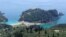 FILE - A portion of the west coast of Corfu is seen on in the Ionian Sea, May 29, 2005. The body of the man was found July 16, 2014, on a rocky and fairly remote beach on the nearby island of Mathraki.