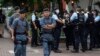 Police officers stand guard outside the West Kowloon Magistrates' Courts in Hong Kong, May 30, 2024.