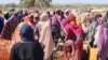 FILE—Refugees fleeing the conflict in Sudan queue with their jerrycans to queue to collect drinking water from the Doctors Without Borders (MSF) distribution point at the Ourang refugee camp in Adre on December 7, 2023.