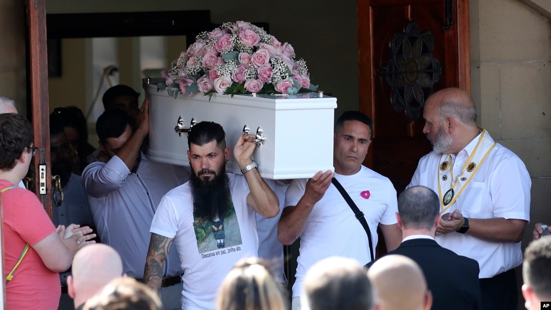 Pall bearers carry the coffin of stabbing victim Alice da Silva Aguiar after her funeral service at St. Patrick's Church in Southport, England, Aug. 11, 2024.
