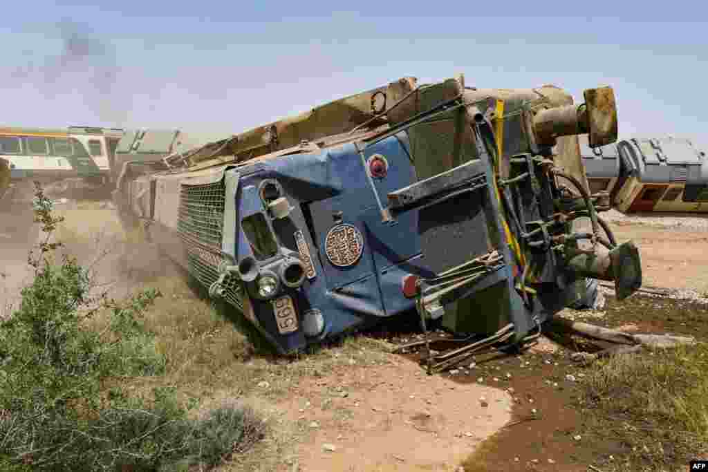 A derailed locomotive is seen at the scene of a train accident near Msaken, about 150 kilometers (95 miles) south of the capital in eastern Tunisia. Two people were killed and 34 injured when an overnight passenger train careered off the tracks and overturned, the state-owned SNCFT rail company said.&nbsp;