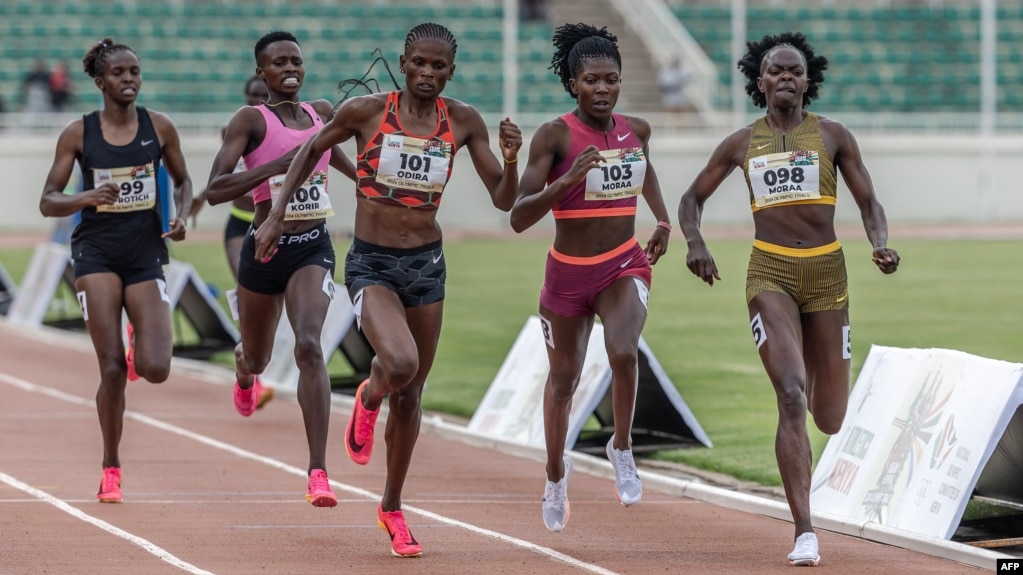 FILE - Kenyan runners Mary Moraa, right, Sarah Moraa, second from right, and Lilian Odira, center, fight for the lead in the women's 800-meter final during the Kenya Athletics Olympic Trials at Nyayo National Stadium in Nairobi, June 14, 2024.