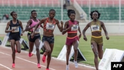 Kenyan runners Mary Moraa, right, Sarah Moraa, second from right, and Lilian Odira, center, fight for the lead in the women's 800-meter final during the Kenya Athletics Olympic Trials at Nyayo National Stadium in Nairobi, on June 14, 2024.