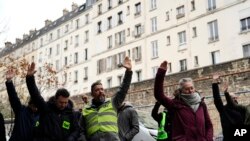 Railway workers vote to renew the strike, March 7, 2023, at the Gare du Nord train station in Paris.