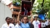 Doctors and residents hold posters and shout slogans during a protest in Mumbai, India, condemning the rape and murder of a trainee medic at a government-run hospital in Kolkata, Aug. 18, 2024. 