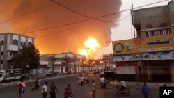 In this image from video, smoke and flames rise from a site in Hodeidah, Yemen, on July 20, 2024.