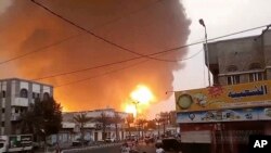 In this image from video, smoke and flames rise from a site in Hodeidah, Yemen, on July 20, 2024.