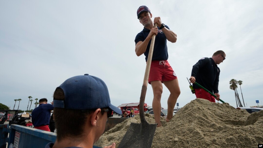 Long Beach lifeguards fill up sandbags for residents ahead of Hurricane Hilary in Long Beach, Calif., Aug. 19, 2023.