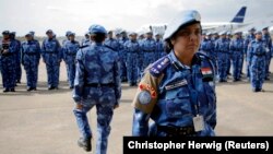 (FILE) The first all-female unit of United Nations peacekeepers stand at attention.