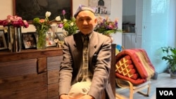 Enver Can, pictured in his home on March 1, 2024, counts himself among the first Uyghurs who resettled in Munich. He worked at Radio Liberty’s Uyghur radio station for several years. (VOA/Liam Scott)