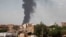 FILE - Smoke rises over Khartoum, Sudan, on June 8, 2023, as fighting between the Sudanese army and paramilitary Rapid Support Forces continued. 