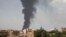 FILE - Smoke rises over Khartoum, Sudan, on June 8, 2023, as fighting between the Sudanese army and paramilitary Rapid Support Forces continued. 