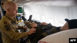 Wounded Ukrainian soldiers are transported in a medical evacuation (Medevac) airplane, in Rzeszow, Poland on March 23, 2023.
