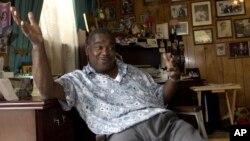 FILE - Clarence "Frogman" Henry gestures during an interview at his home in Algiers, La., June 12, 2003. Henry, one of New Orleans’ best known old-time R&B singers who scored a hit at age 19 with “Ain't Got No Home" in 1956, has died at age 87.