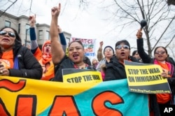 FILE - Groups protest at a rally launching the "Stop the Coup 2025" campaign against Project 2025, Jan. 27, 2024, in Washington. (Center for Popular Democracy via AP)