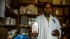 FILE - A nurse shows a box of Zidovudine — a drug prescribed to prevent the contraction of HIV/AIDS — to a patient at a USAID-supported clinic in Bunyakiri, DRC, Jan 15, 2017.