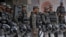 Paramilitary troops stand guard with riot gears to ensure security following angry Muslim mob attacked Christian area in Jaranwala near Faisalabad, Pakistan, Aug. 17, 2023. Police confirmed, Sept. 4, 2023, that Pastor Vicky was shot and wounded in the neighborhood.